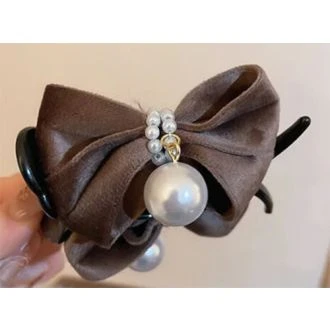 Haarklem met bruine strik en parels