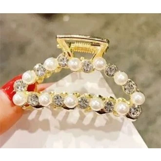 Gouden haarklem halve maan parel/ strass