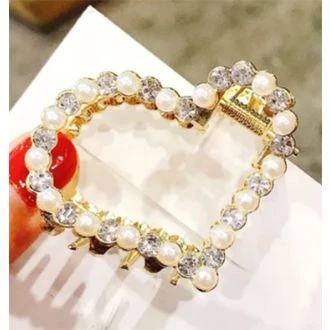 Gouden haarklem hartje parel