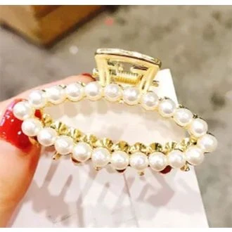 Gouden haarklem ovaal parel