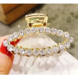 Gouden haarklem ovaal strass