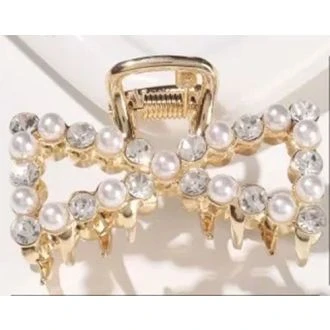 Gouden haarklem strikje parel/ strass