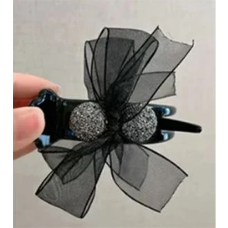 Haarklem met zwarte strik en glinsteringen